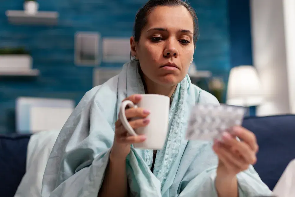 Patient receiving care and holding medication